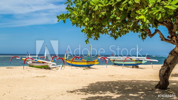 Bild på Beach in bali three boats ready to sail